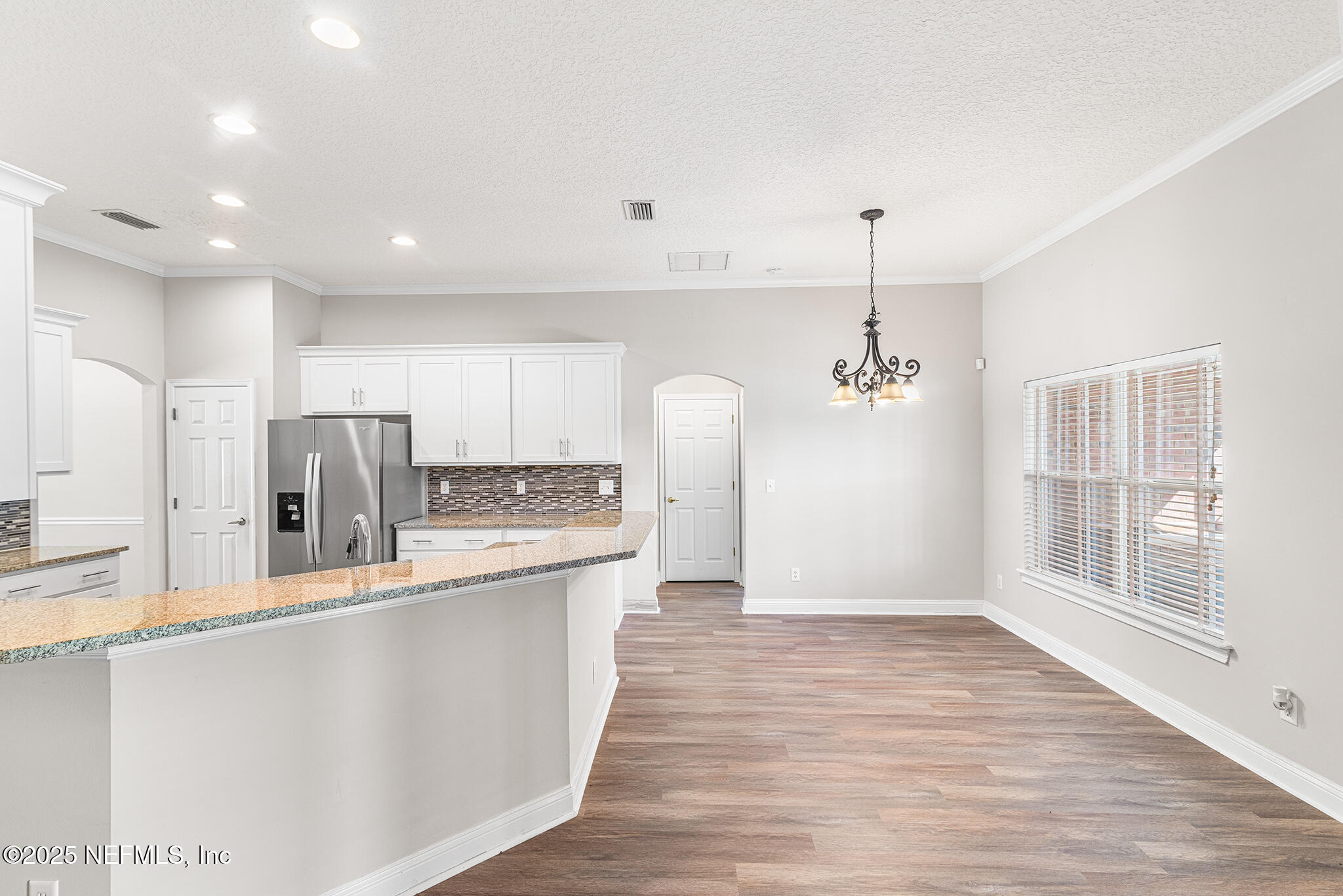 10922 Dunnotar Road Jacksonville, FL 32221 - Photo 15 of 35 a kitchen with stainless steel appliances granite countertop a refrigerator a sink dishwasher a stove and a refrigerator