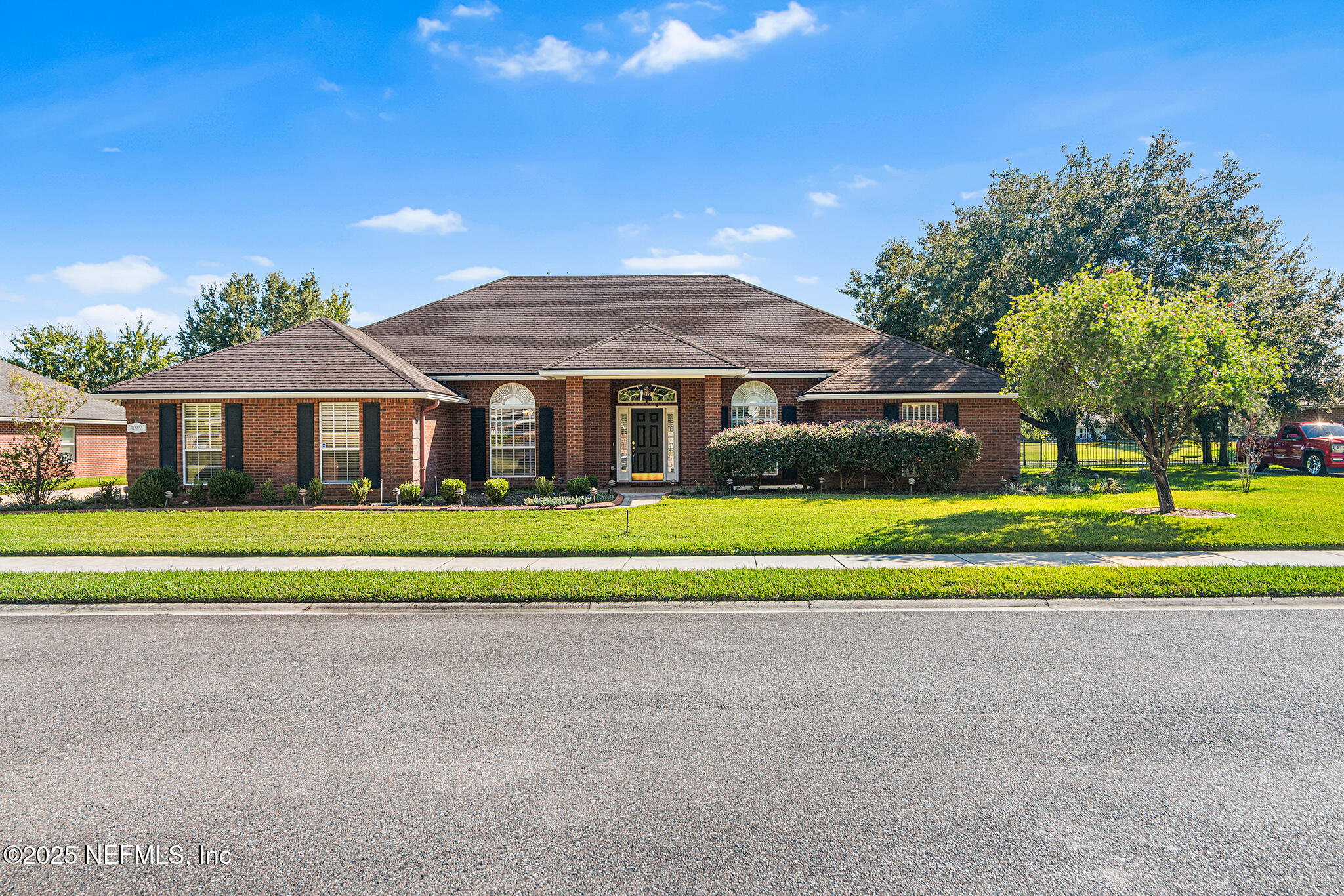 10922 Dunnotar Road Jacksonville, FL 32221 - Photo 2 of 35 a front view of a house with a yard