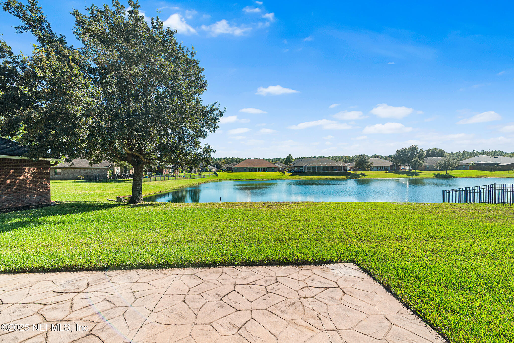 10922 Dunnotar Road Jacksonville, FL 32221 - Photo 30 of 35 a view of a lake with a big yard