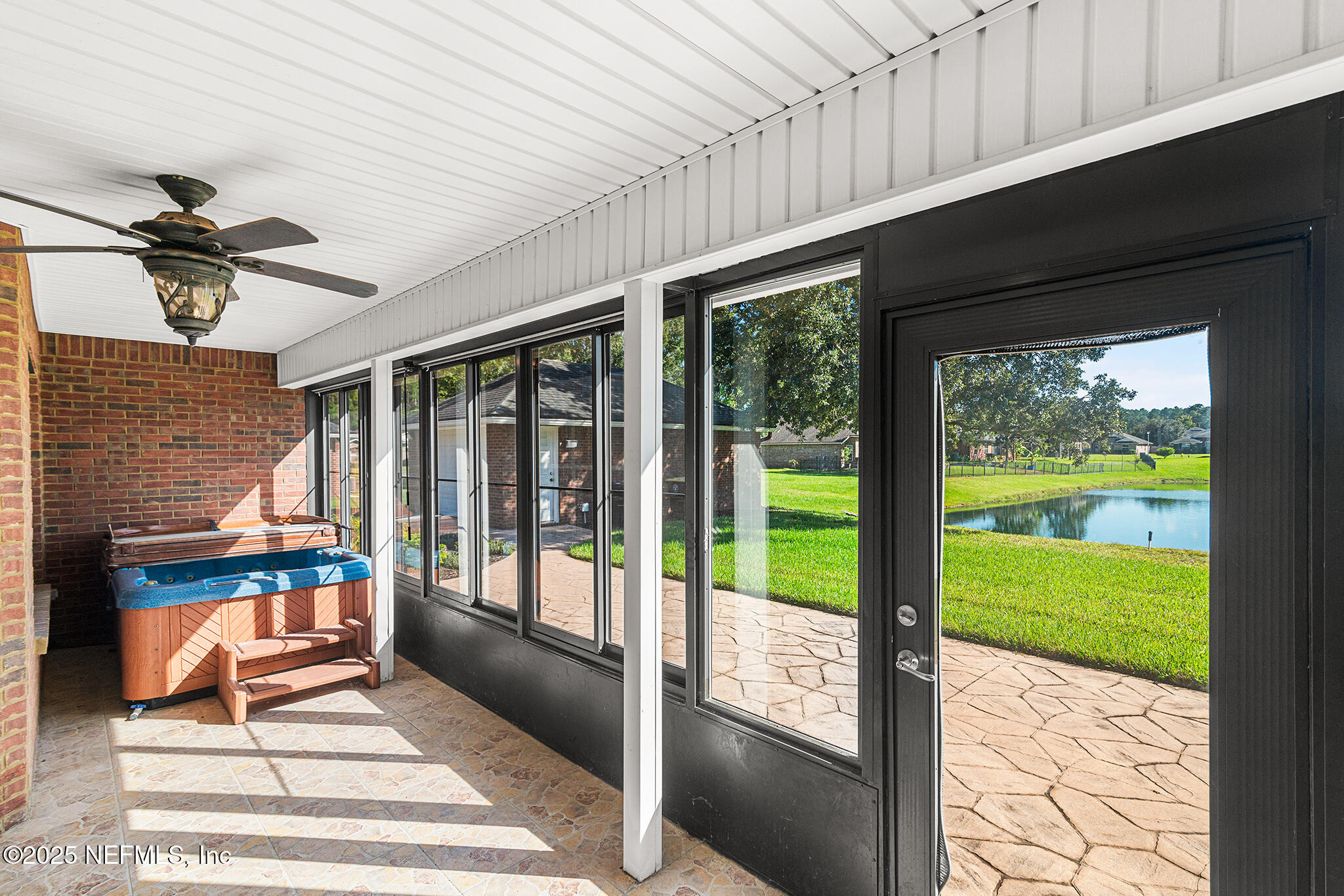 10922 Dunnotar Road Jacksonville, FL 32221 - Photo 31 of 35 a living room with large windows