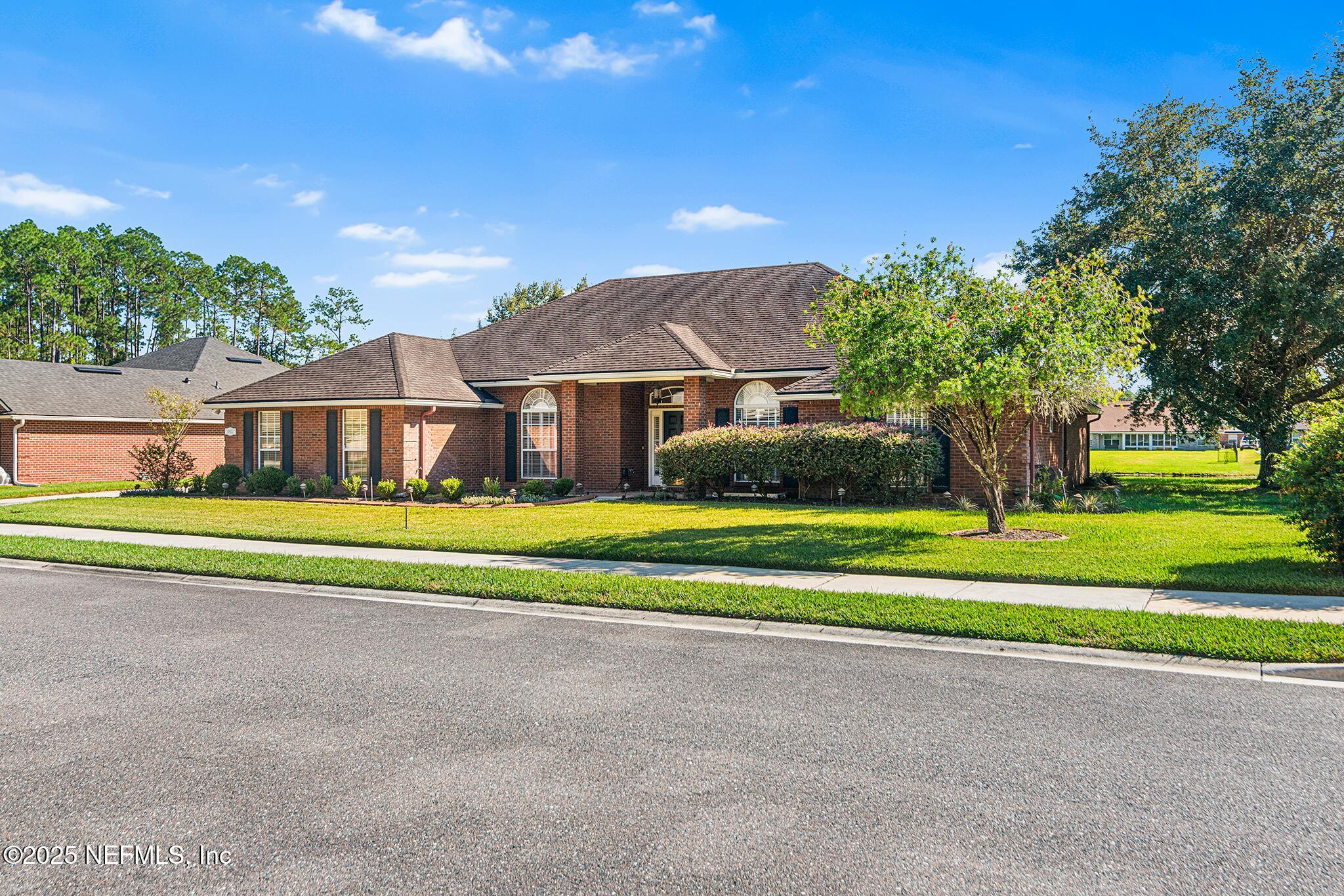 10922 Dunnotar Road Jacksonville, FL 32221 - Photo 35 of 35 a front view of a house with a yard