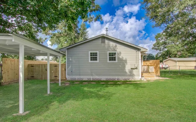 a backyard of a house with lots of green space
