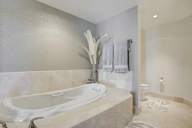 a bathroom with a bathtub and a sink