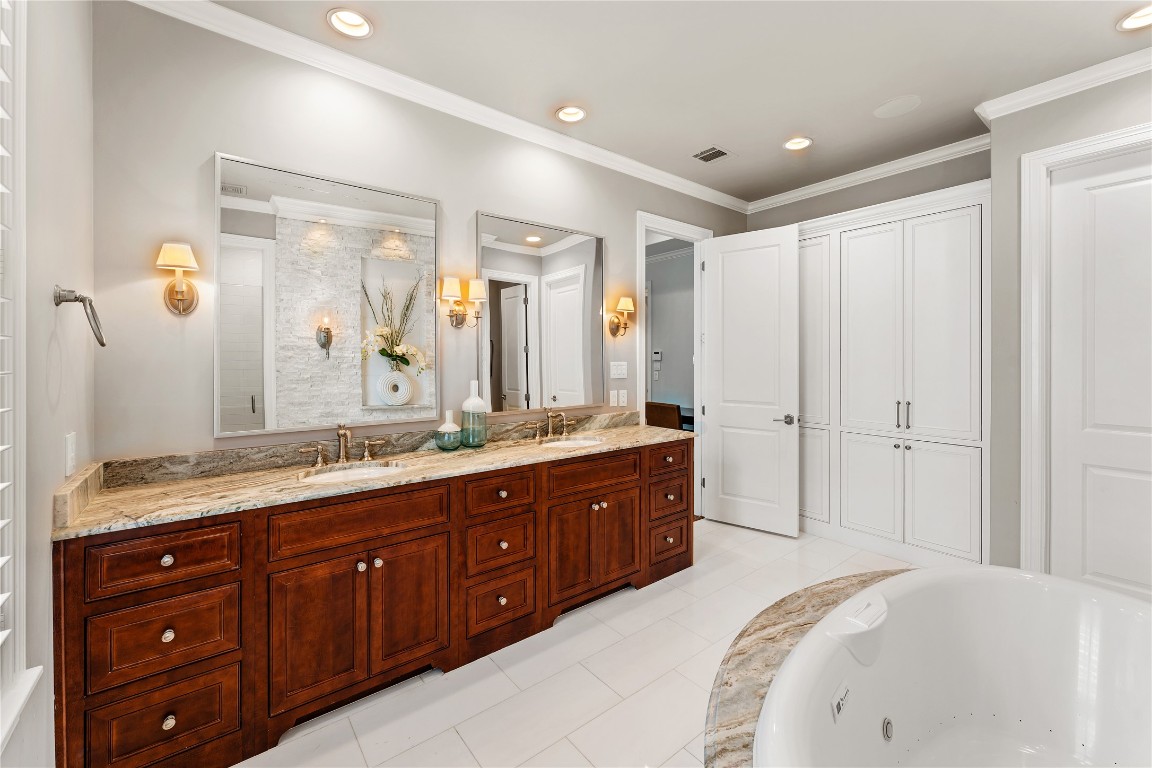2109 Bancroft Lane Houston, TX 77027 - Photo 30 of 40 a spacious bathroom with a double vanity sink and mirror with shower