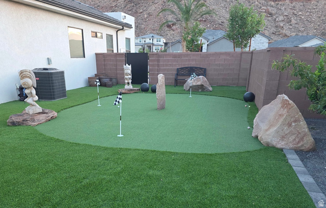 6105 Bunda Way St. George, UT 84790 - Photo 34 of 49 Backyard putting green surrounded by artificial turf