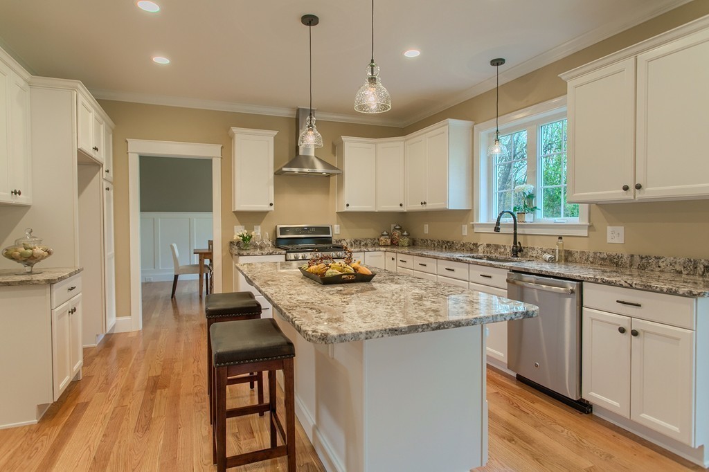 184 Gates Pond Road Berlin, MA 01503 - Photo 6 of 30 a kitchen with stainless steel appliances granite countertop a stove a sink dishwasher and a refrigerator with wooden floor