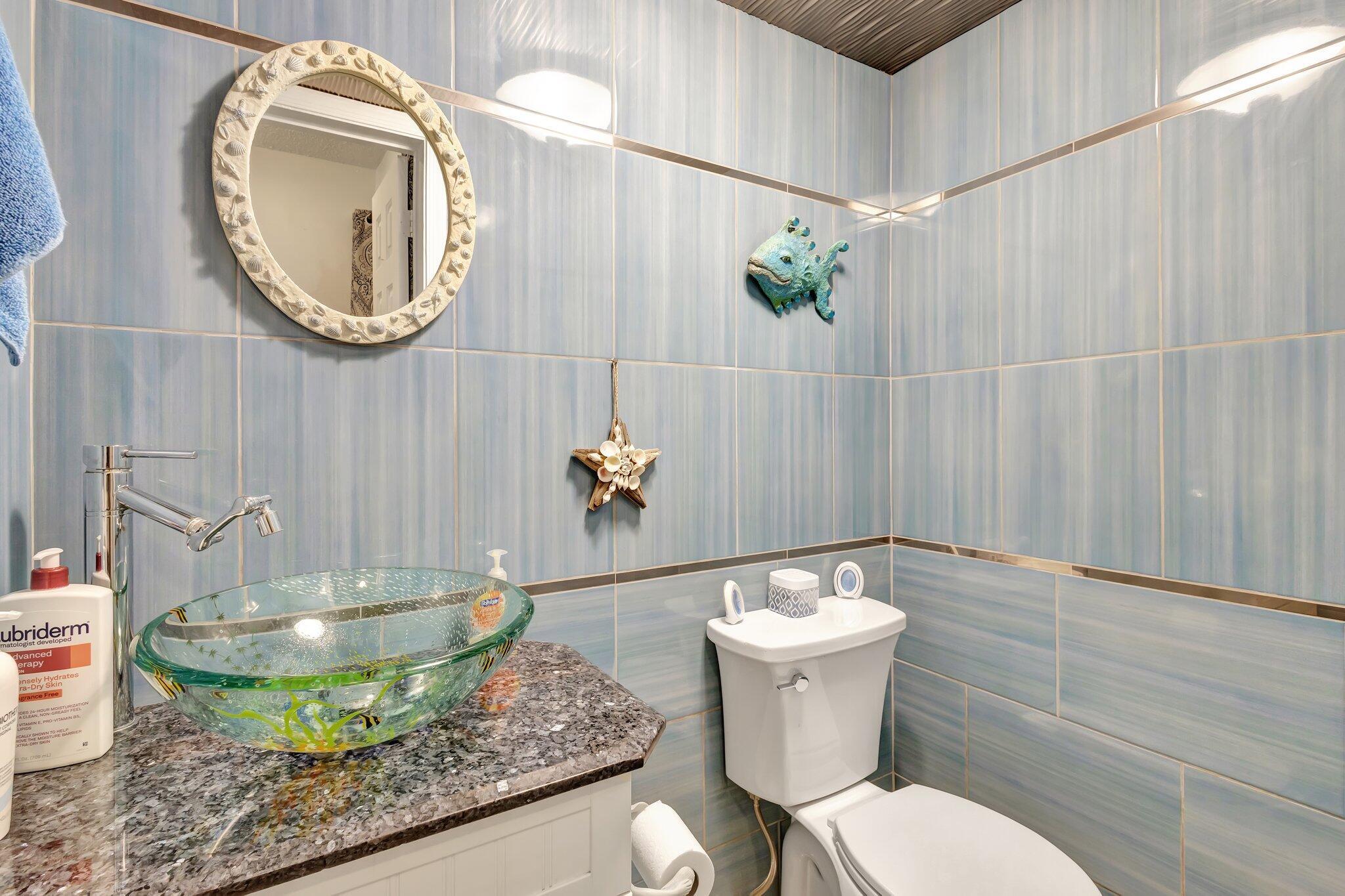 2936 Kirk Road Lake Worth Beach, FL 33461 - Photo 13 of 19 a bathroom with a sink and a mirror