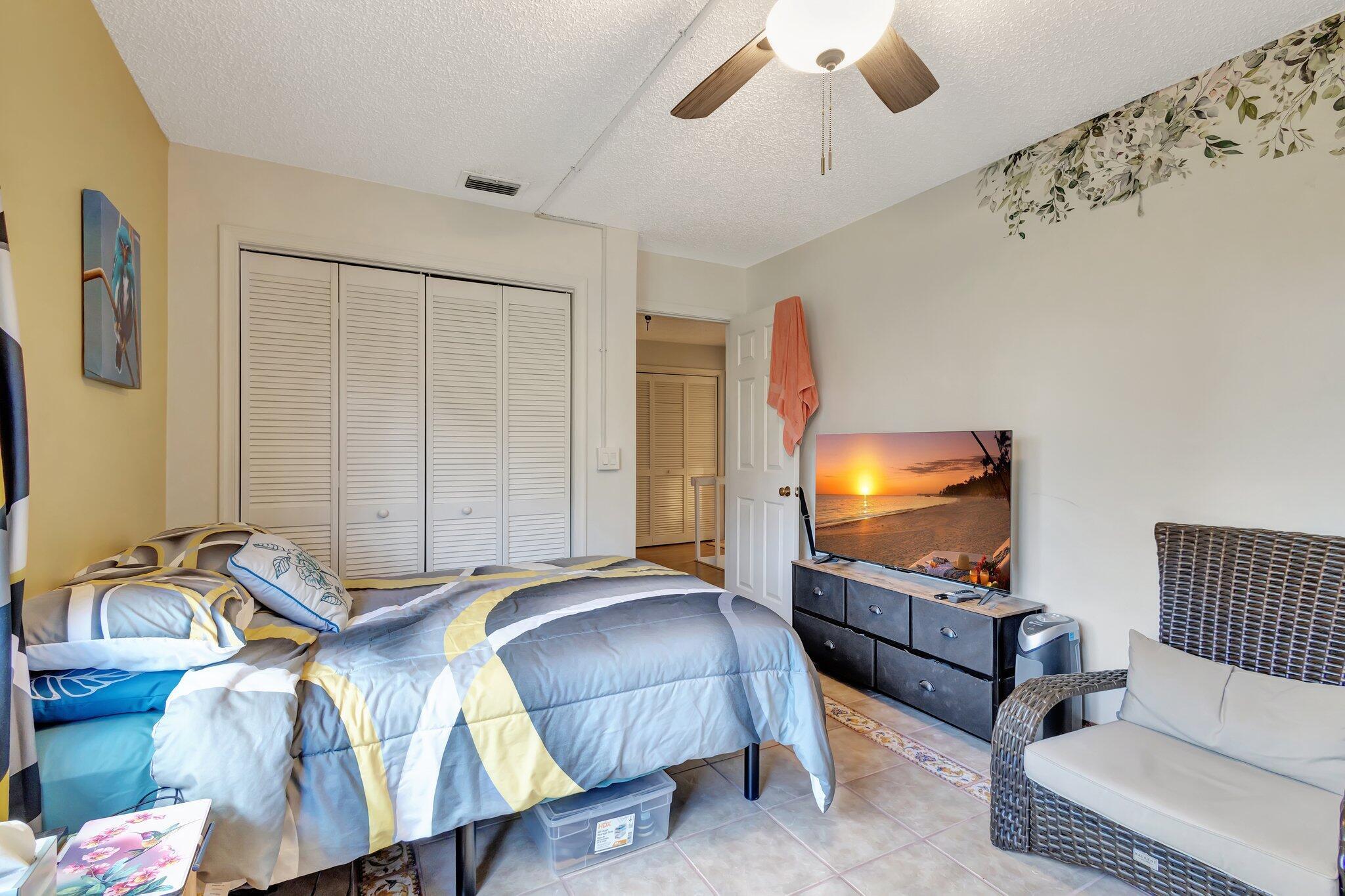 2936 Kirk Road Lake Worth Beach, FL 33461 - Photo 17 of 19 a living room with furniture and a flat screen tv