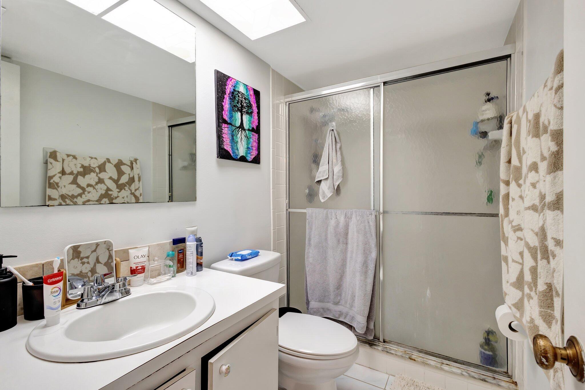 2936 Kirk Road Lake Worth Beach, FL 33461 - Photo 18 of 19 a bathroom with a sink toilet and shower