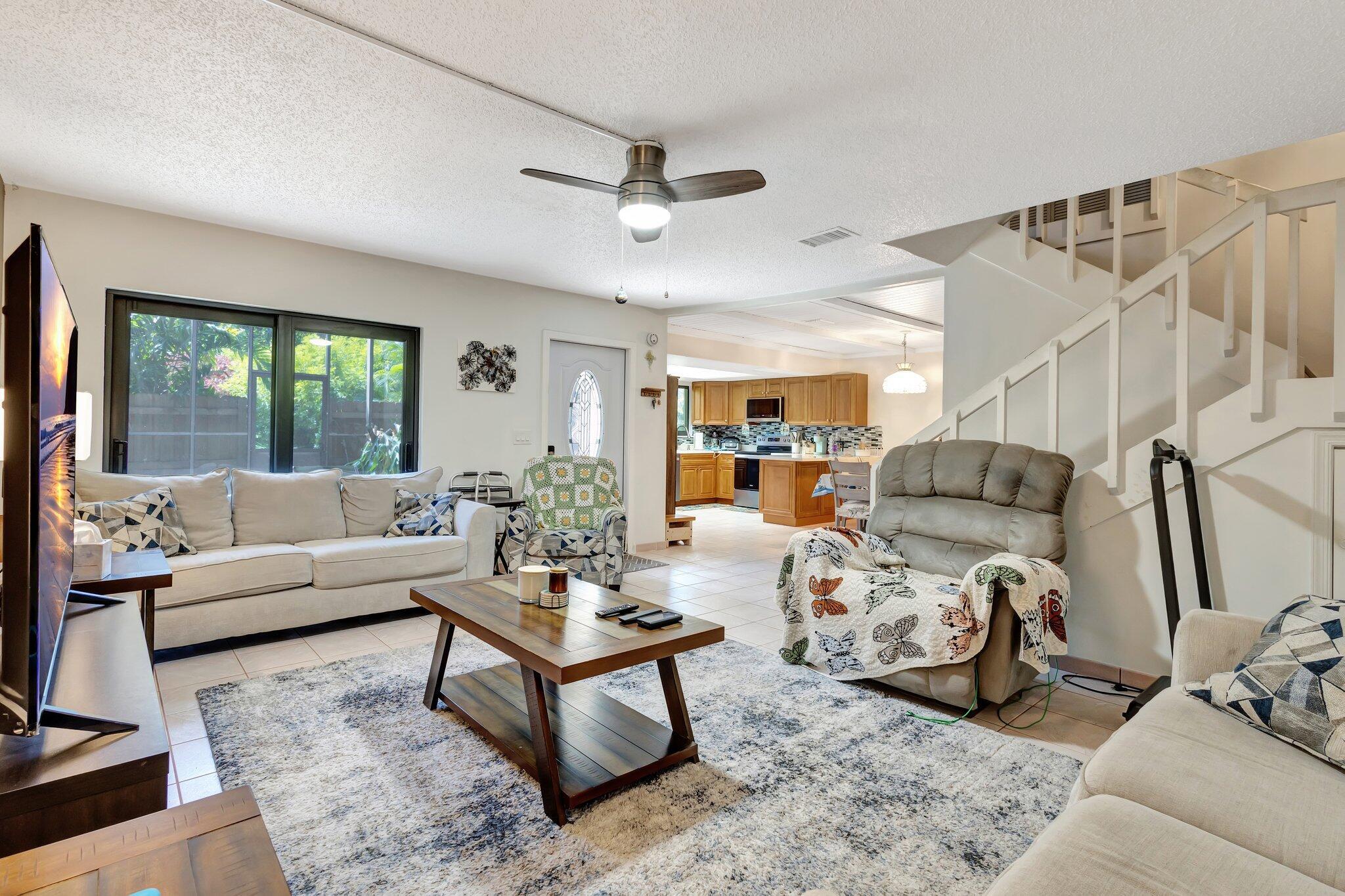 2936 Kirk Road Lake Worth Beach, FL 33461 - Photo 3 of 19 a living room with furniture or window and a wooden floor