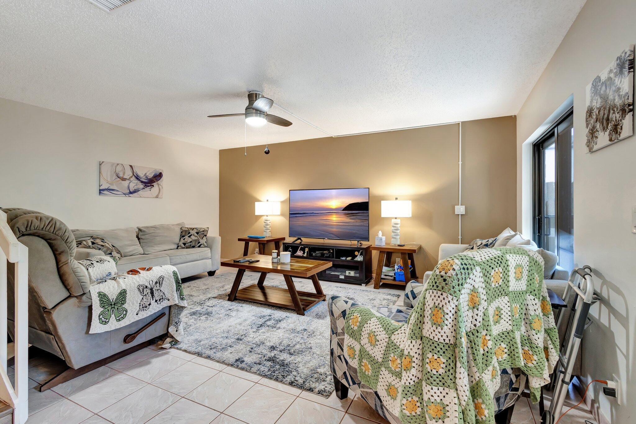 2936 Kirk Road Lake Worth Beach, FL 33461 - Photo 4 of 19 a living room with furniture and a flat screen tv