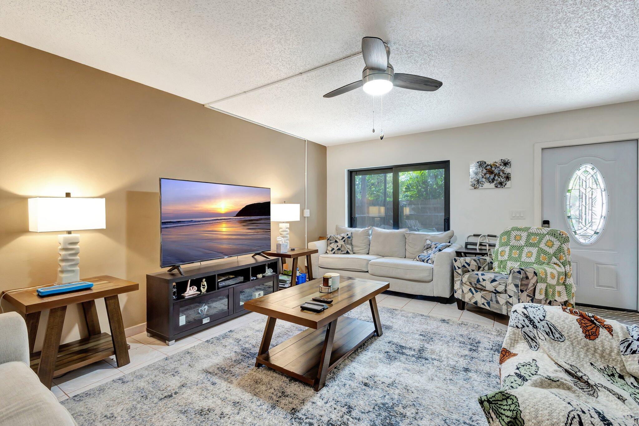 2936 Kirk Road Lake Worth Beach, FL 33461 - Photo 5 of 19 a living room with furniture and a flat screen tv