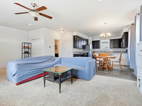 a living room with furniture and a table