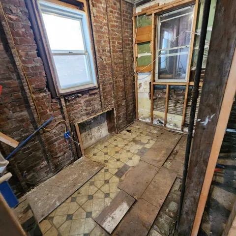 a view of an empty room with windows