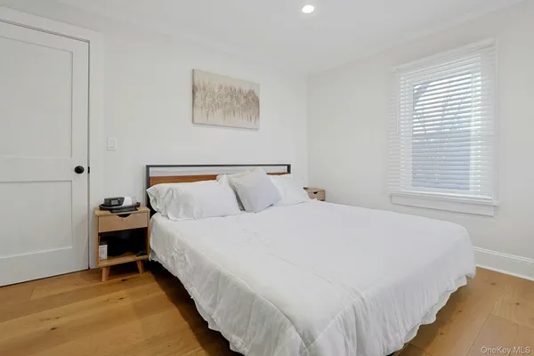 a bedroom with bed and window