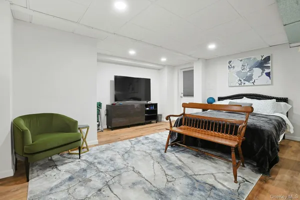 a bedroom with furniture and a chair