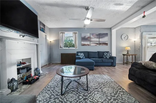 a living room with furniture and a flat screen tv