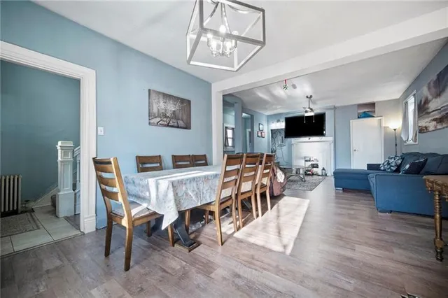 a view of a dining room with furniture and wooden floor