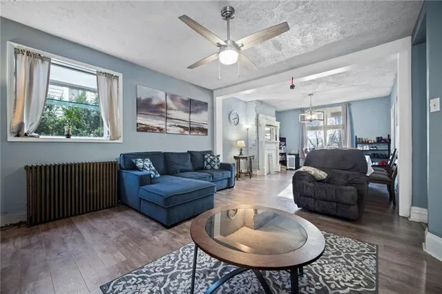 a living room with furniture and a large window