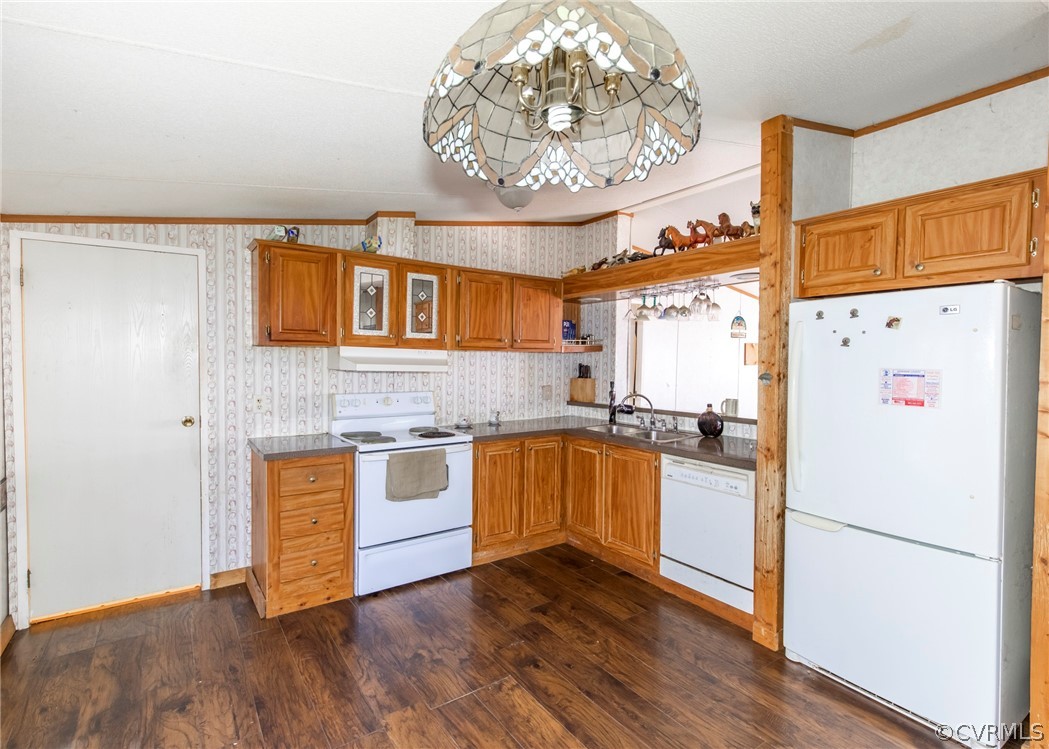 14306 Wilkinson Road Dewitt, VA 23840 - Photo 13 of 23 a kitchen with stainless steel appliances granite countertop a refrigerator a stove and a wooden floors