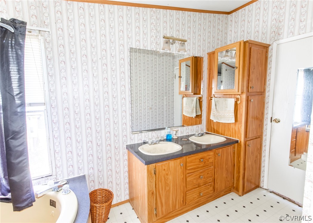 14306 Wilkinson Road Dewitt, VA 23840 - Photo 18 of 23 a bathroom with a granite countertop sink and a mirror
