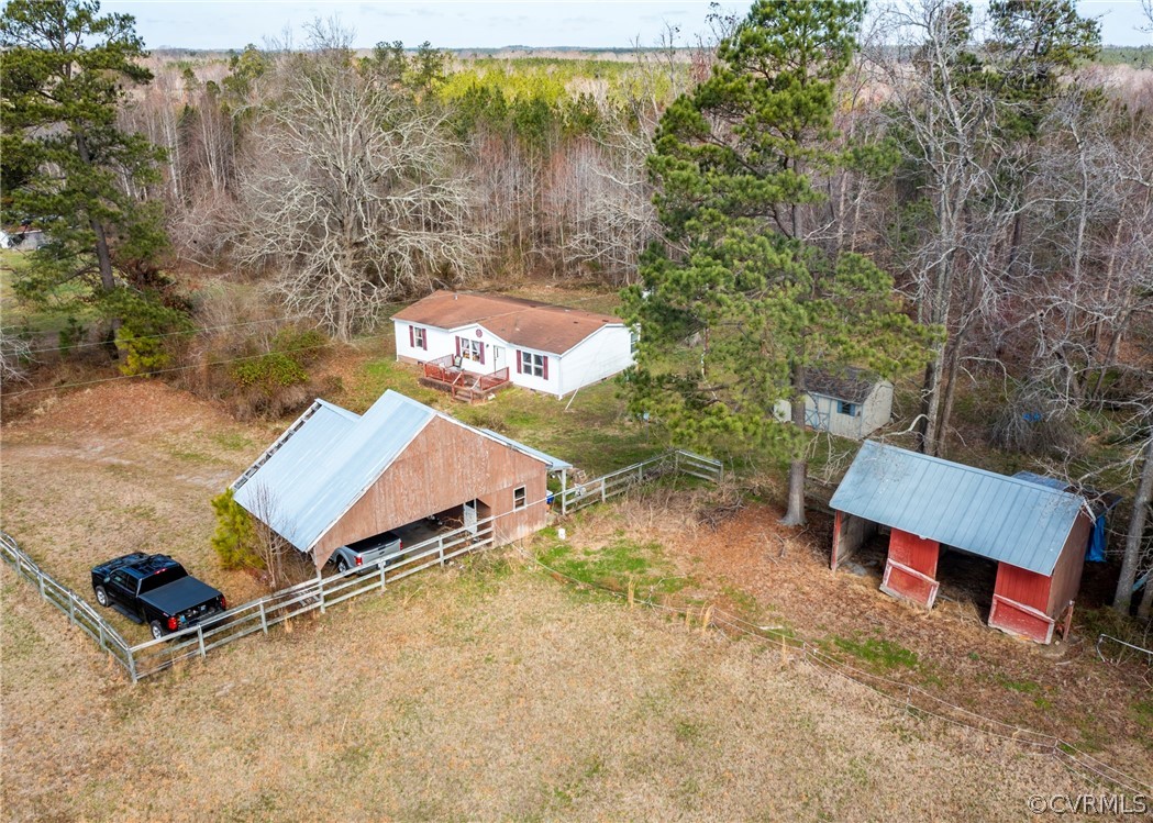 14306 Wilkinson Road Dewitt, VA 23840 - Photo 3 of 23 an aerial view of a house with yard and street