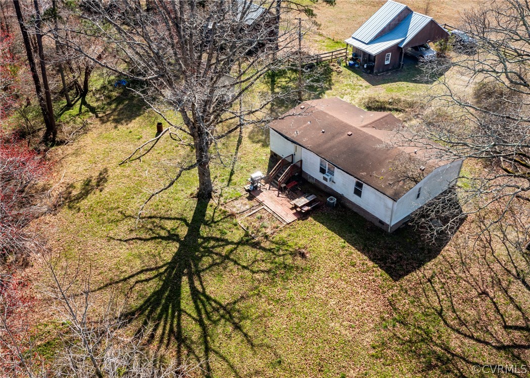 14306 Wilkinson Road Dewitt, VA 23840 - Photo 6 of 23 a bench sitting in the middle of a yard