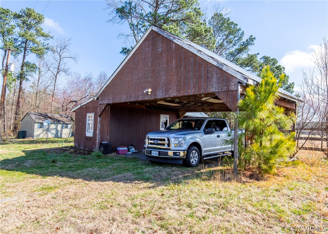 14306 Wilkinson Road Dewitt, VA 23840 - Photo 8 of 23 a car parked in front of a house