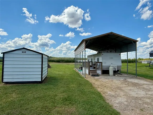 a view of a patio with a yard