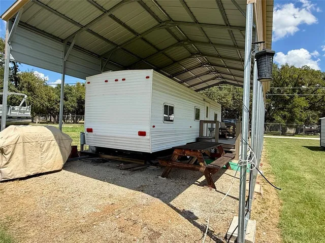 a bedroom with bed and a window