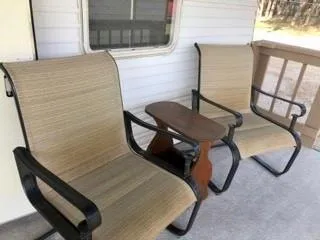 a view of a house with backyard sitting area and porch