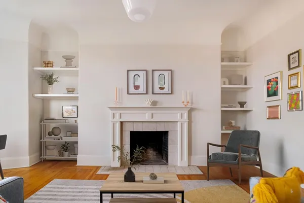 a living room with furniture or couch and a fireplace