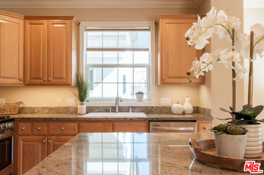 826 Main Street, Unit 6 El Segundo, CA 90245 - Photo 14 of 33 a kitchen with a sink and cabinets