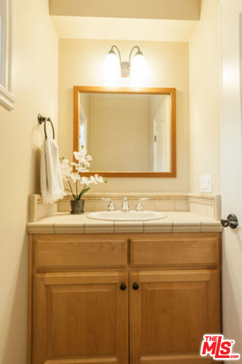826 Main Street, Unit 6 El Segundo, CA 90245 - Photo 16 of 33 a bathroom with a sink and a mirror