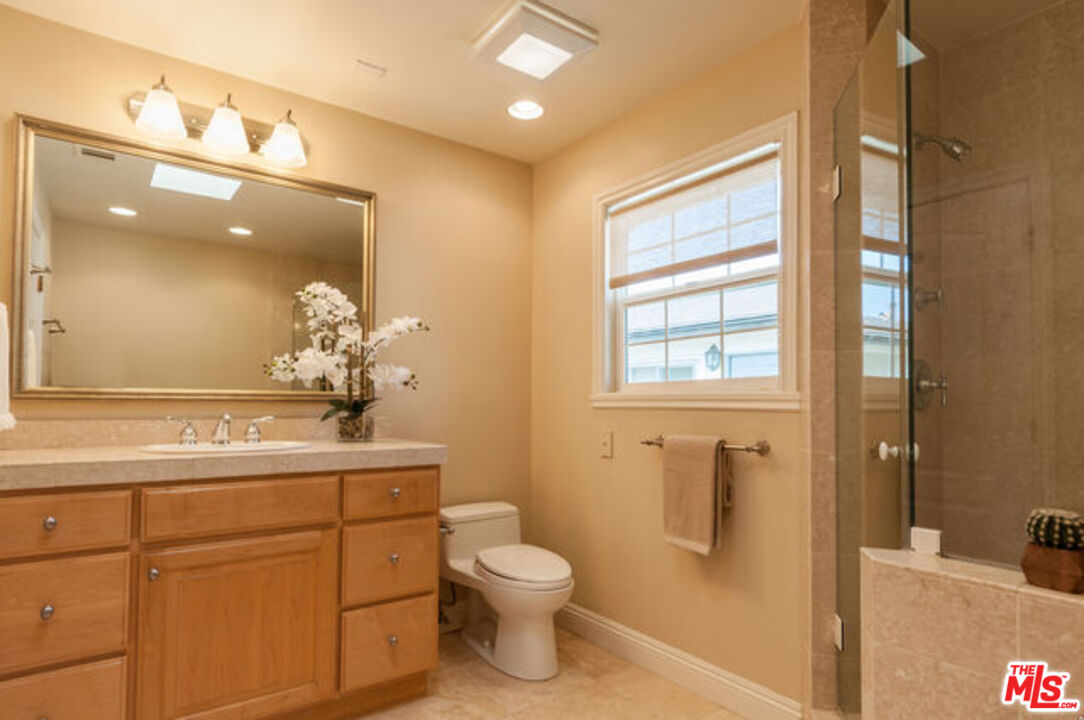 826 Main Street, Unit 6 El Segundo, CA 90245 - Photo 19 of 33 a bathroom with a toilet sink and mirror