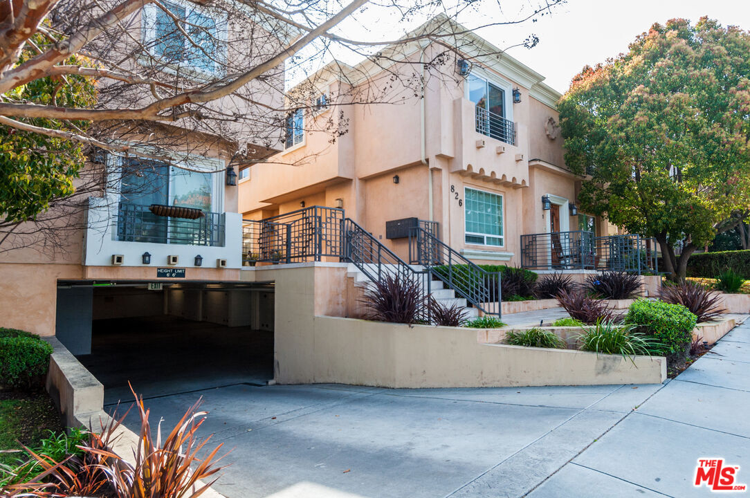 826 Main Street, Unit 6 El Segundo, CA 90245 - Photo 29 of 33 a view of a building with a yard and sitting area