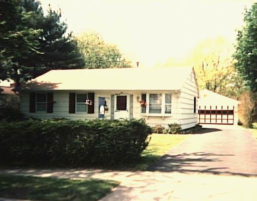 84 Morningmist Road Milford, CT 06460 - Photo 1 of 1 a front view of a house with a garden