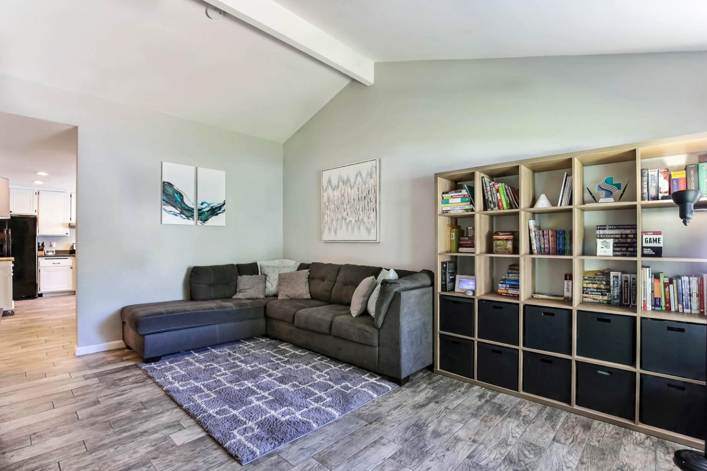 5085 Derek Drive San Jose, CA 95136 - Photo 3 of 18 a living room with a couch and a book shelf