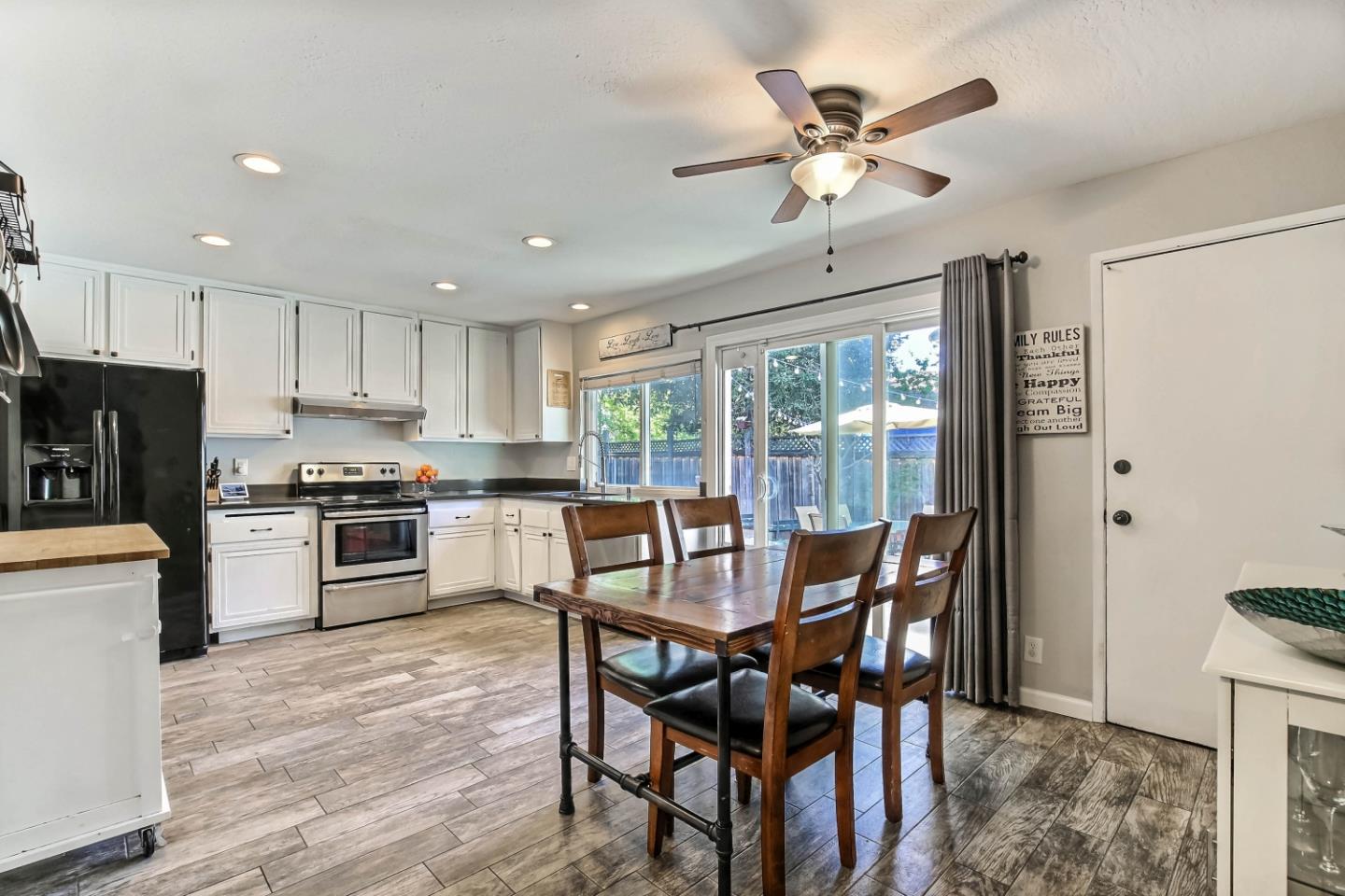 5085 Derek Drive San Jose, CA 95136 - Photo 5 of 18 a view of a dining room with furniture window and wooden floor