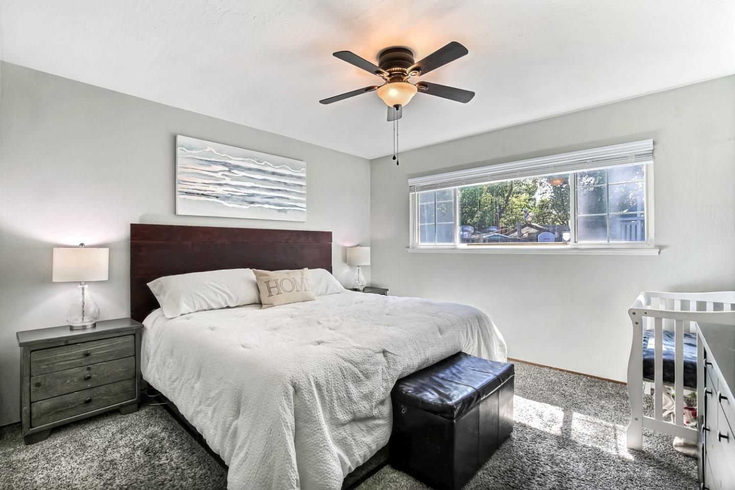 5085 Derek Drive San Jose, CA 95136 - Photo 8 of 18 a bedroom with a bed and a window