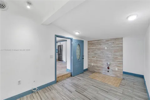 a view of backyard with wooden fence