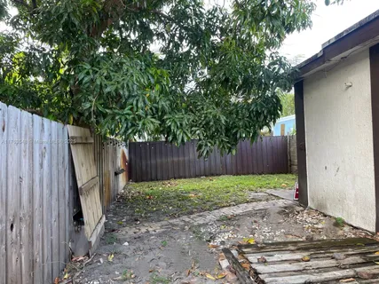 a view of wooden fence in the backyard