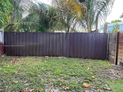 a view of a backyard of the house