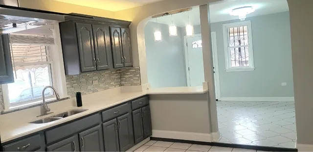 a kitchen with stainless steel appliances a refrigerator and a sink