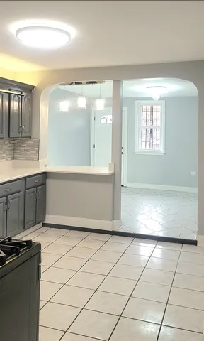 a kitchen with a sink and cabinets