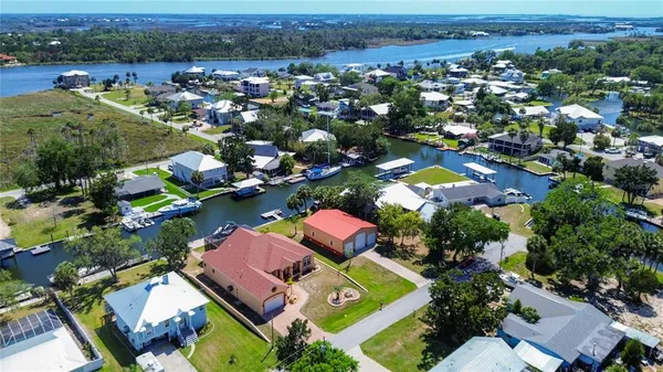 an aerial view of a houses with a lake view