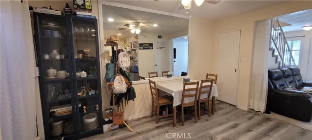 a view of a hallway with wooden floor and a fireplace