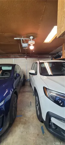 a bedroom with a bed and a television in it