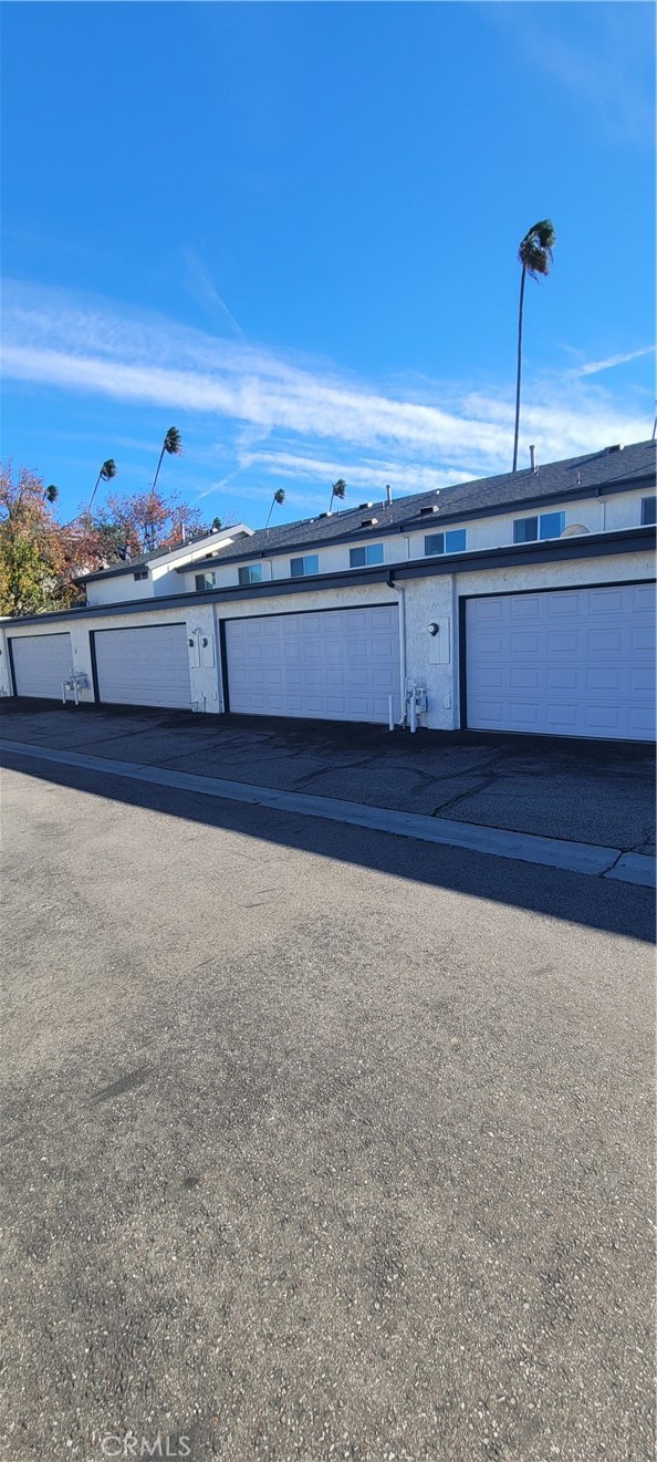 19221 Sherman Way, Unit 6 Reseda, CA 91335 - Photo 22 of 35 a kitchen with stainless steel appliances granite countertop a sink and cabinets