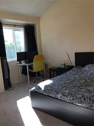 a view of room with window and furniture